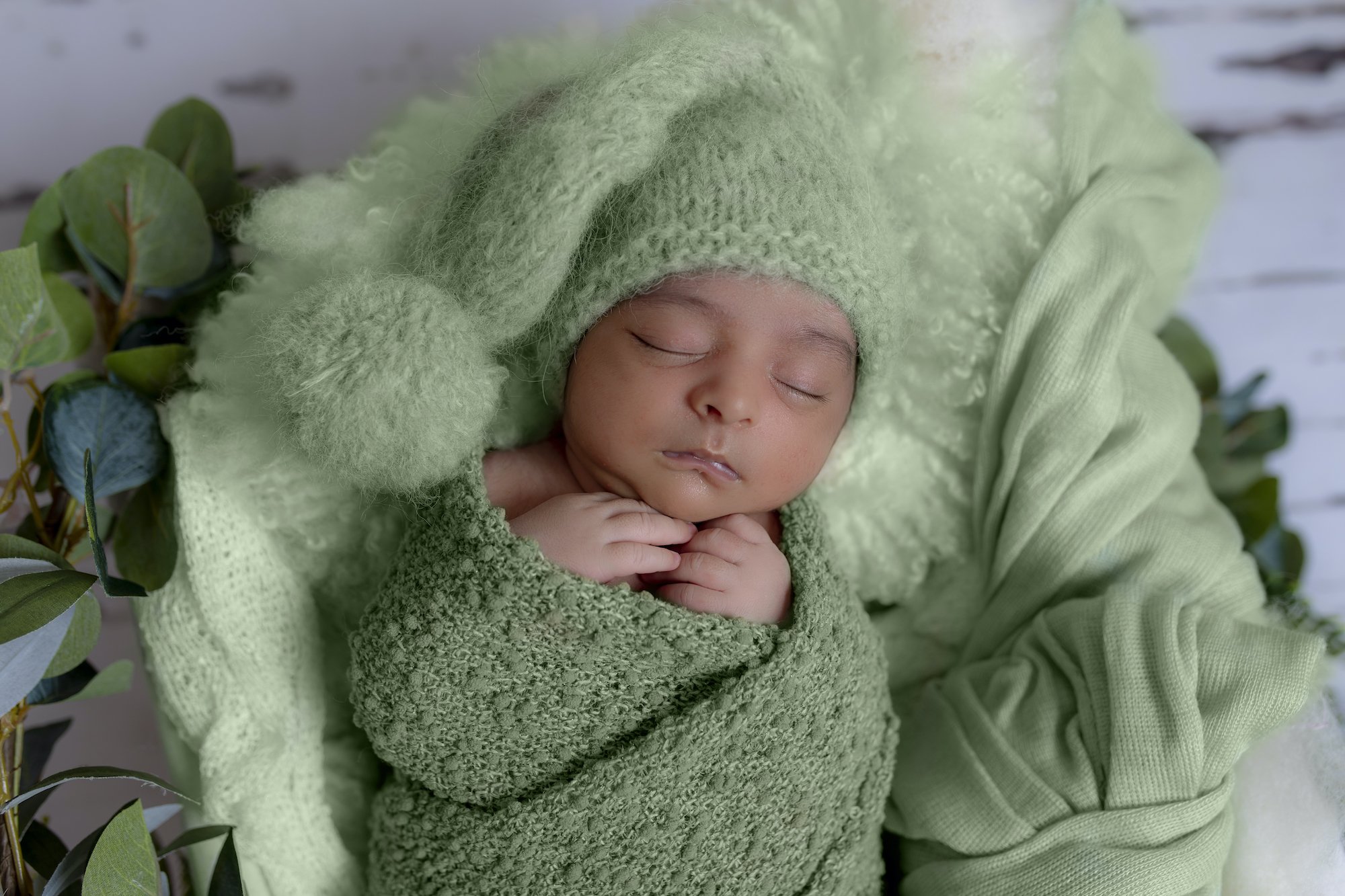 Emma Lowe Baby Photoshoot Boy- Newborn Photographer using green tones