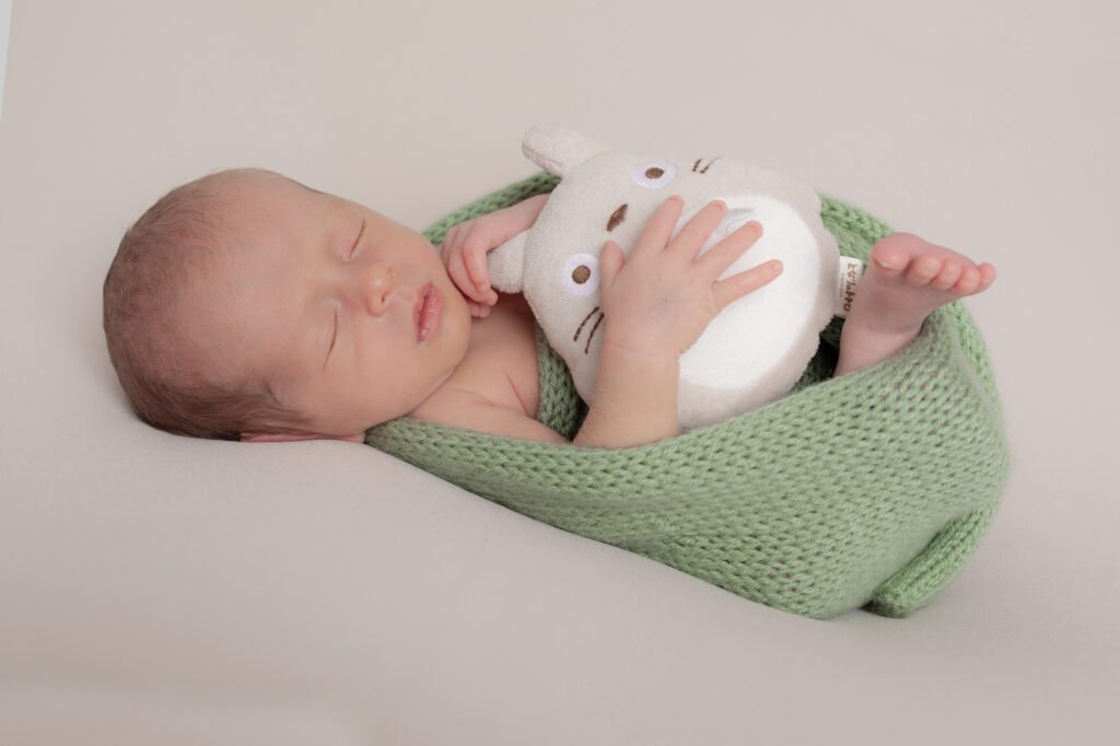 Newborn baby Photographer - Emma Lowe Photography using natural light greens