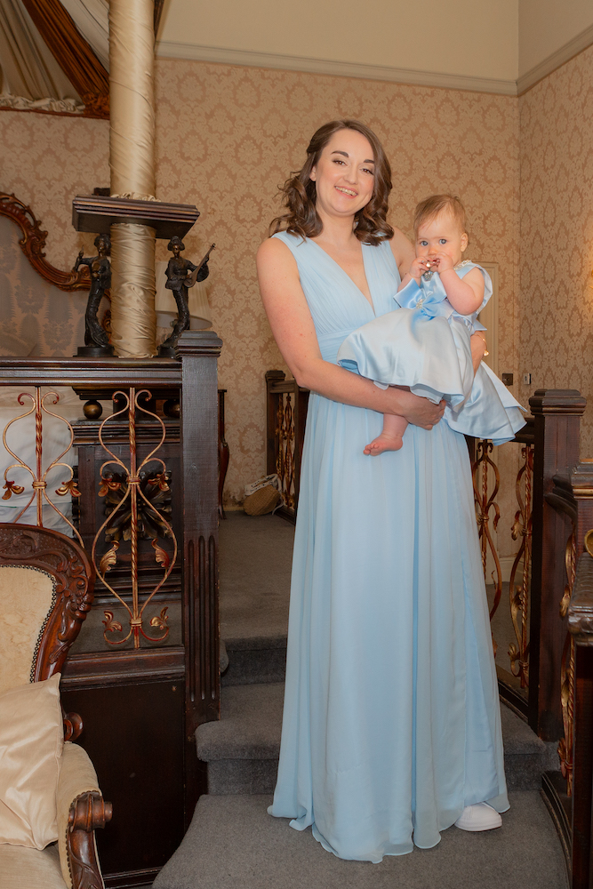Bridesmaid & Brides Daughter having a cuddle