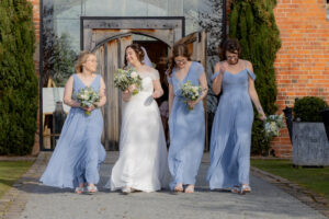 Bride with her bridesmaids having fun relaxed photoshoot