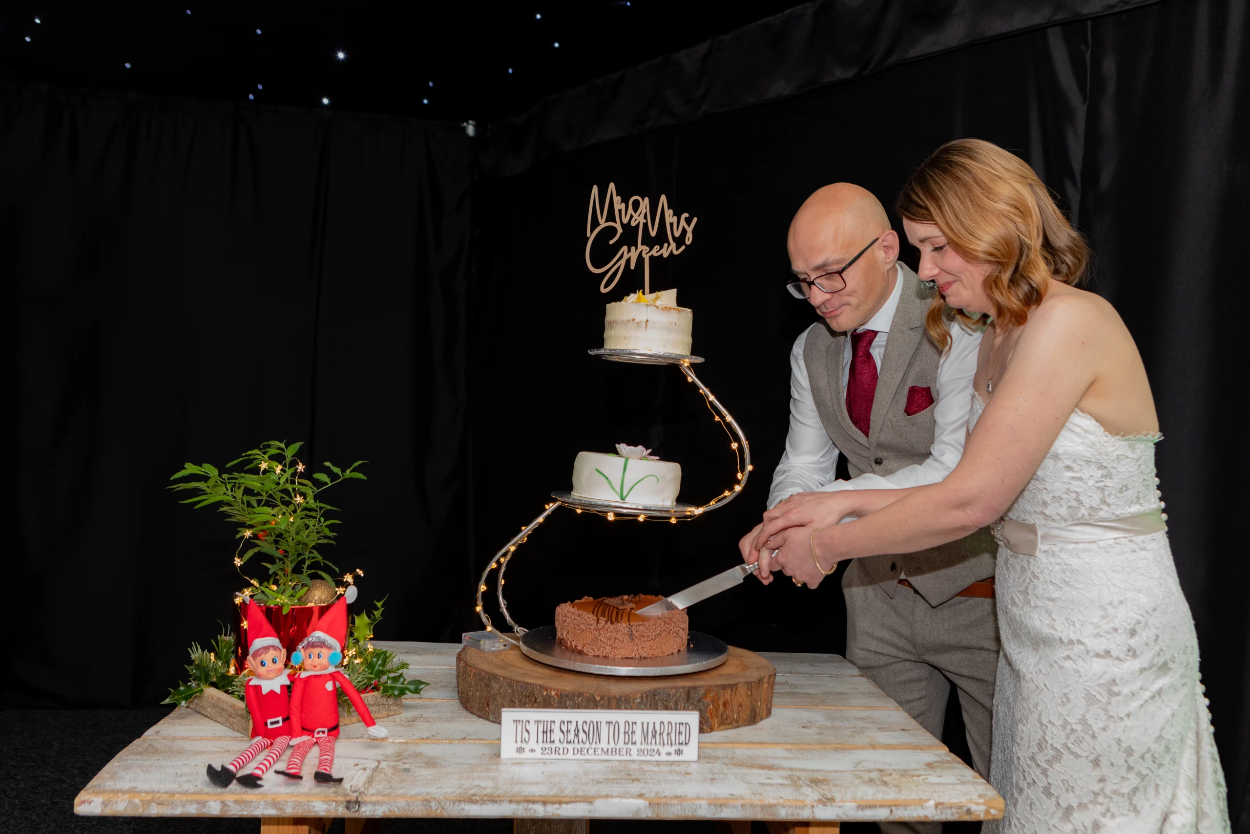 Cake Cut at Ashton Lodge Christmas Wedding Emma Lowe Photography